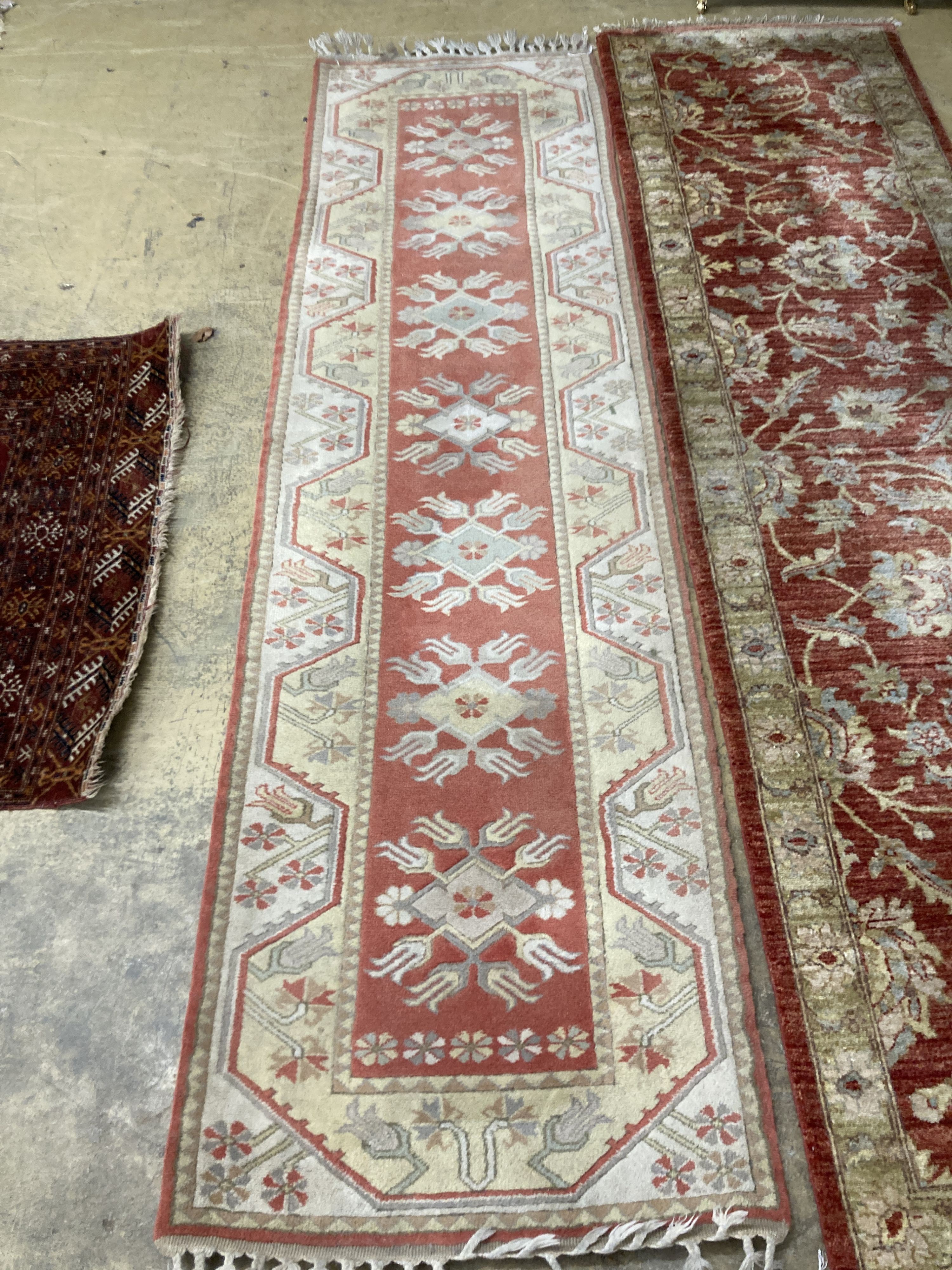 An Afghan Ziegler peach ground runner and another runner, largest 310 x 84cm